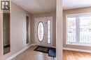 Foyer entrance featuring healthy amount of natural light and light tile patterned flooring - 162 Solomon Crescent, Hamilton, ON  - Indoor Photo Showing Other Room 