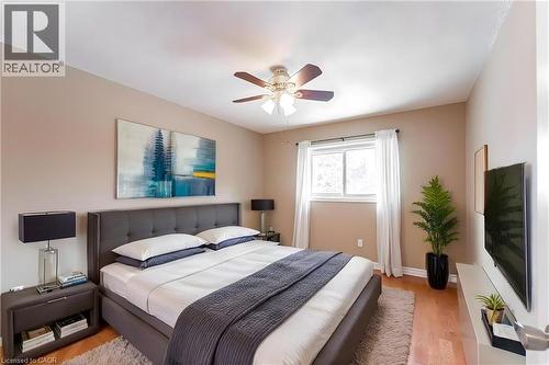 Bedroom featuring light wood finished floors and a ceiling fan - 162 Solomon Crescent, Hamilton, ON - Indoor Photo Showing Bedroom