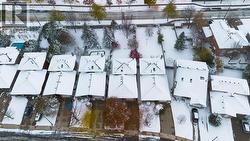 Snowy aerial view featuring a residential view - 