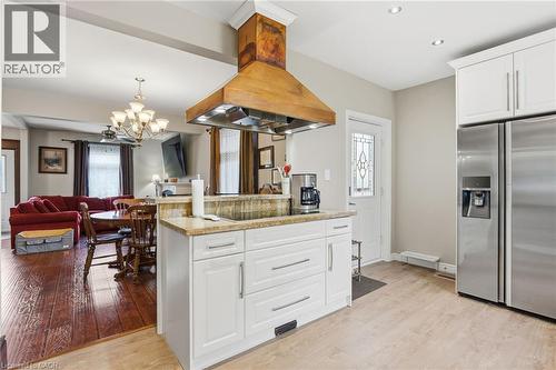 Main house - Kitchen Island with built in stove top - 26 Terrace Hill Street, Brantford, ON - Indoor Photo Showing Kitchen
