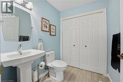 Laundry room on main level in powder room (behind sliding doors) - 
