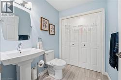 Laundry room on main level in powder room (behind sliding doors) - 