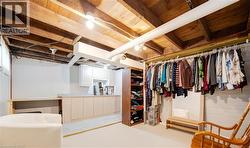 Finished below grade area featuring wood walls - 