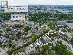 Aerial view of property's location with nearby urban area and property parcel outlined - 