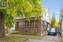 View of home's exterior featuring brick siding and a sunroom - 41 Rose Street, Kitchener, ON  - Outdoor 