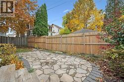Fenced backyard featuring a patio area - 