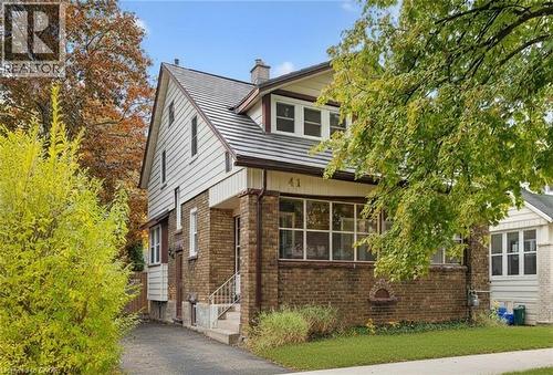 View of front facade featuring brick siding and a chimney - 41 Rose Street, Kitchener, ON - Outdoor