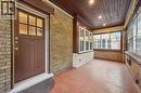 Unfurnished sunroom with brick wall, wood-type flooring, wood ceiling, and recessed lighting - 41 Rose Street, Kitchener, ON  -  With Exterior 