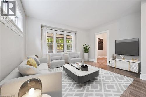 Living room featuring wood finished floors and baseboards - 41 Rose Street, Kitchener, ON - Indoor Photo Showing Living Room