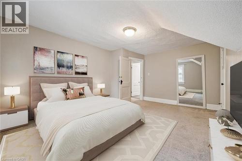 Bedroom featuring carpet flooring and a textured ceiling - 41 Rose Street, Kitchener, ON - Indoor Photo Showing Bedroom