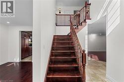 Stairway with recessed lighting and tile patterned floors - 