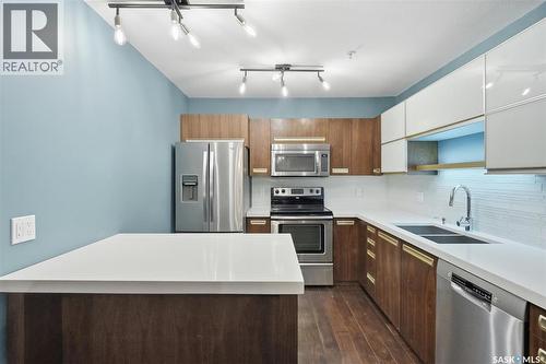 112 130 Phelps Way, Saskatoon, SK - Indoor Photo Showing Kitchen With Double Sink