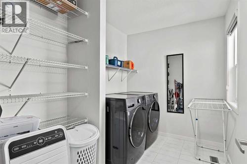 38 Seton Parade Se, Calgary, AB - Indoor Photo Showing Laundry Room