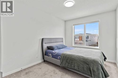 38 Seton Parade Se, Calgary, AB - Indoor Photo Showing Bedroom