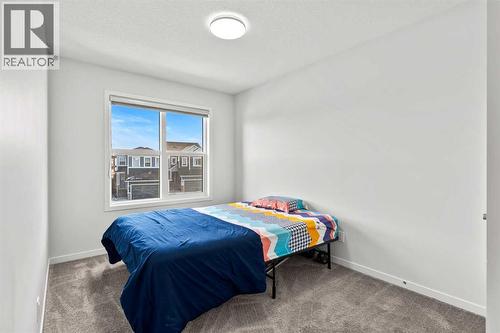38 Seton Parade Se, Calgary, AB - Indoor Photo Showing Bedroom