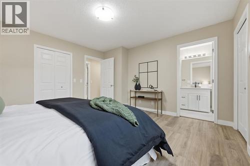 117 Panatella Park Nw, Calgary, AB - Indoor Photo Showing Bedroom