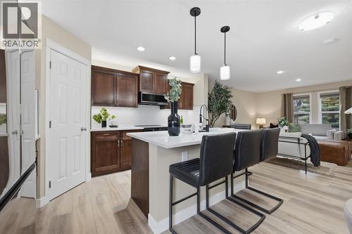 117 Panatella Park Nw, Calgary, AB - Indoor Photo Showing Kitchen With Upgraded Kitchen