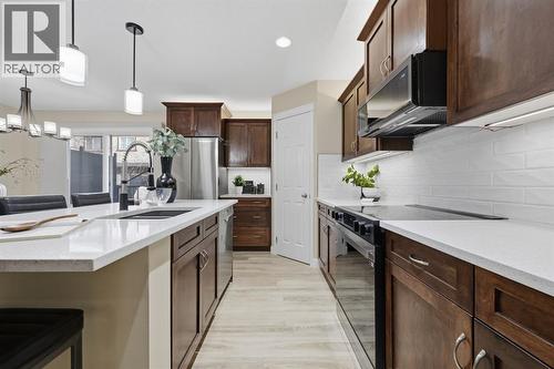 117 Panatella Park Nw, Calgary, AB - Indoor Photo Showing Kitchen With Upgraded Kitchen