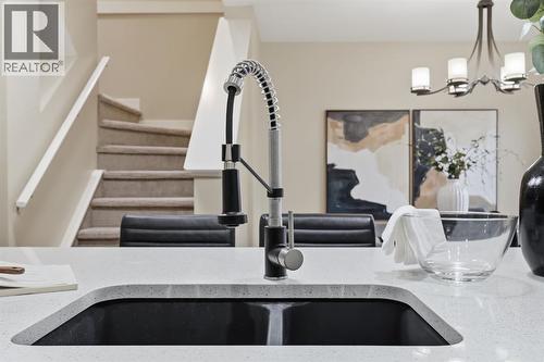 117 Panatella Park Nw, Calgary, AB - Indoor Photo Showing Kitchen With Double Sink