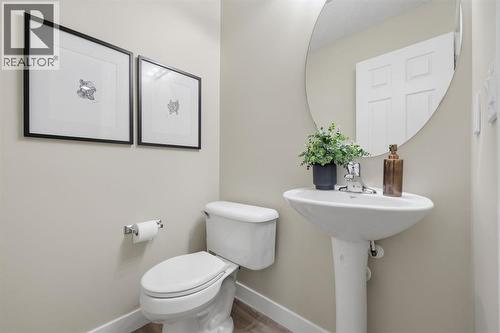 Powder room on main - 117 Panatella Park Nw, Calgary, AB - Indoor Photo Showing Bathroom