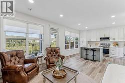 Spacious open-concept design featuring a connected kitchen and living room - 