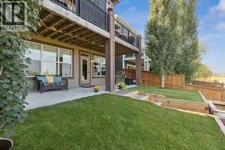 Lower patio to enjoy in your landscaped backyard - 