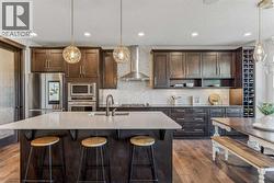 Stunning Kitchen featuring Upgraded Appliances, a Spacious Island, and Elegant Tile Finishes - 
