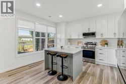 Fully developed walk-out basement with a private kitchen, bathroom, and living space - 