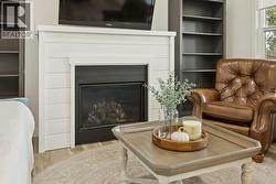 Cozy Gas Fireplace with shiplap surround and mantle - 