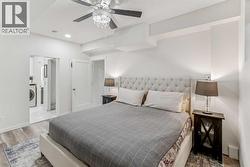 4th Bedroom in Basement with Ceiling Fan and Chandelier lighting - 