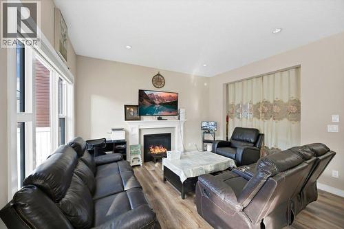 93 Saddlestone Place Ne, Calgary, AB - Indoor Photo Showing Living Room With Fireplace