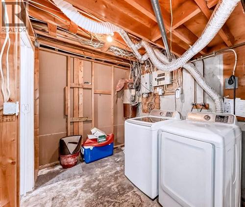 Basement Washer Dryer - 707 Malvern Drive Ne, Calgary, AB - Indoor Photo Showing Laundry Room