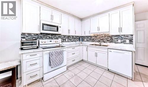 Kitchen full angle - 707 Malvern Drive Ne, Calgary, AB - Indoor Photo Showing Kitchen With Double Sink