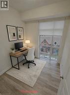 Virtually Staged 2nd Bedroom or office with wood-type flooring and baseboards - 