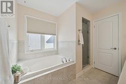 Oversized soaker tub & separate shower w/glass dr - 