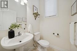 Powder room with high ceilings and large window - 