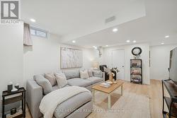 Basement family room with pot lighting & vinyl flr - 