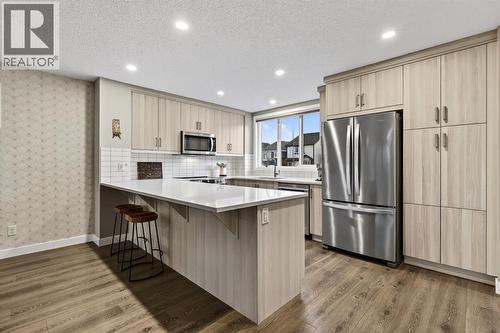 295 Masters Row Se, Calgary, AB - Indoor Photo Showing Kitchen With Upgraded Kitchen