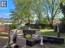 Fenced backyard featuring a storage unit, an outdoor living space, and a deck - 89 Deschene Avenue, Hamilton, ON  - Outdoor 