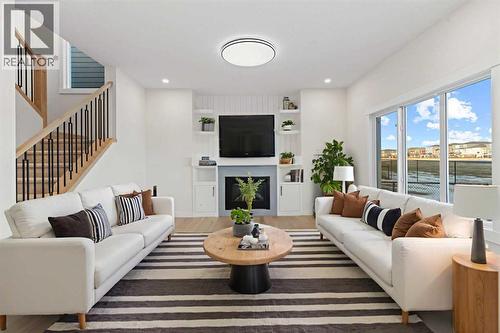 14 Ranchers Meadows, Okotoks, AB - Indoor Photo Showing Living Room With Fireplace