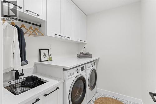 14 Ranchers Meadows, Okotoks, AB - Indoor Photo Showing Laundry Room