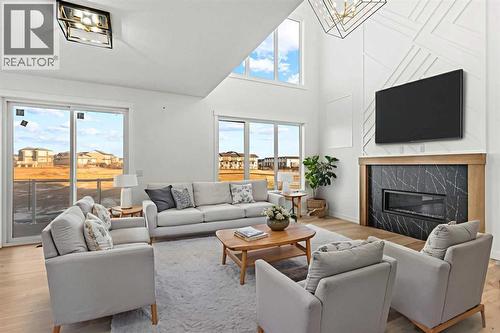 8 Ranchers Meadows, Okotoks, AB - Indoor Photo Showing Living Room With Fireplace