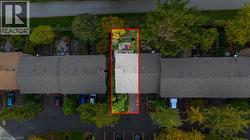 Aerial view of property's location featuring property parcel outlined - 