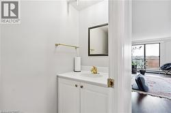 Bathroom featuring vanity and wood finished floors - 