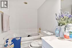 Full bathroom with a garden tub and vanity - 