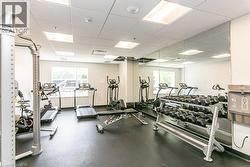 Exercise room featuring a drop ceiling - 