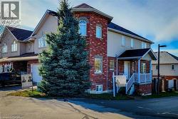 Traditional-style home with brick siding and stucco siding - 