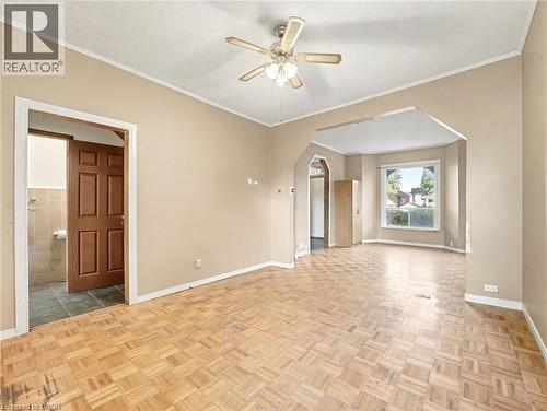 Spare room with ornamental molding, arched walkways, and ceiling fan - 23 Oak Avenue, Hamilton, ON - Indoor Photo Showing Other Room