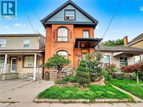 Victorian house with brick siding and a porch - 23 Oak Avenue, Hamilton, ON - Outdoor With Deck Patio Veranda