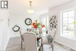 Dining space with light wood-style floors - 